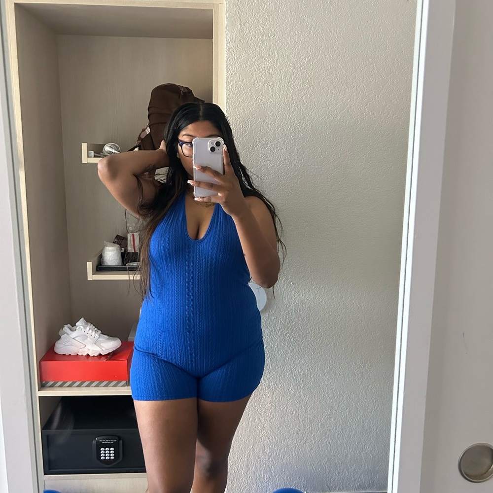 A XL blue romper that was wore only ONCE! it’s an open back